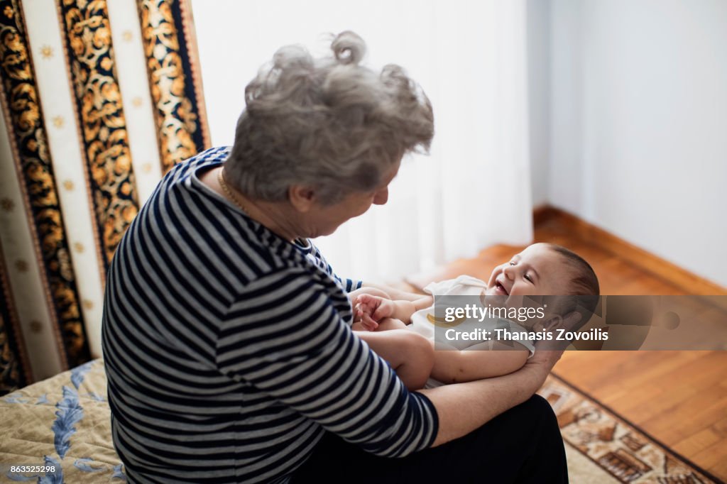 Grandmother holding her grandson