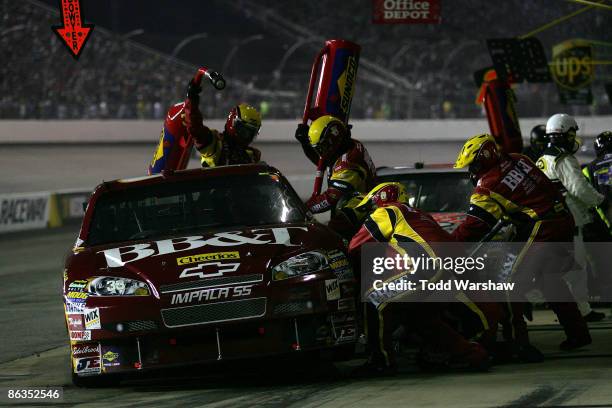 Clint Bowyer, driver of the BB&T Chevrolet, comes in for a pit stop during the NASCAR Sprint Cup Series Crown Royal Presents the Russ Friedman 400 at...