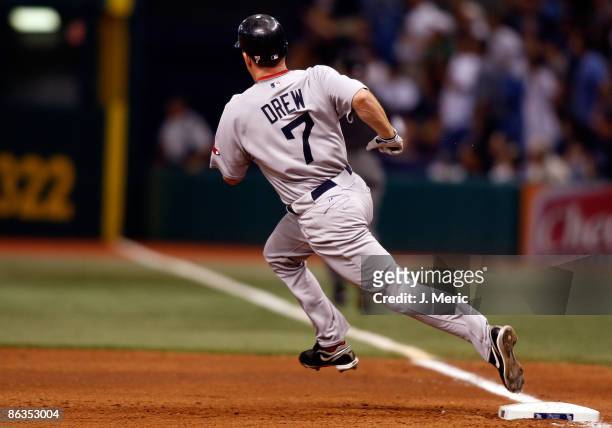 Outfielder J.D. Drew of the Boston Red Sox rounds first after hitting a double against the Tampa Bay Rays during the game at Tropicana Field on May...