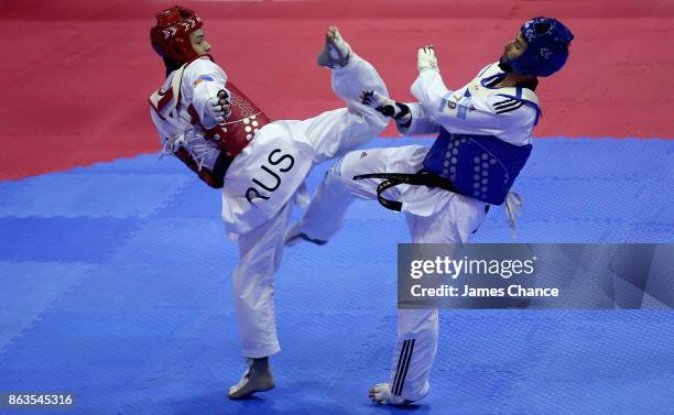 Konstantin Minin of Russia kicks Berkay Akyol of Turkey during there -68kg fight during the 2017 WTF World Taekwondo Grand-Prix Series at Copper Box...