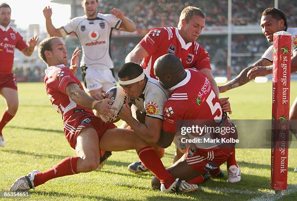 Jerome Ropati of the Warriors beats the Dragons defence to score in the corner during the round eight NRL match between the St George Illawarra...