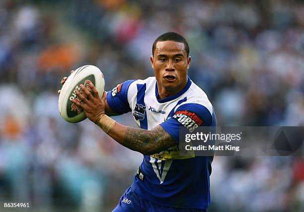 Ben Roberts of the Bulldogs runs with the ball during the round eight NRL match between the Bulldogs and the Wests Tigers at ANZ Stadium on May 3,...