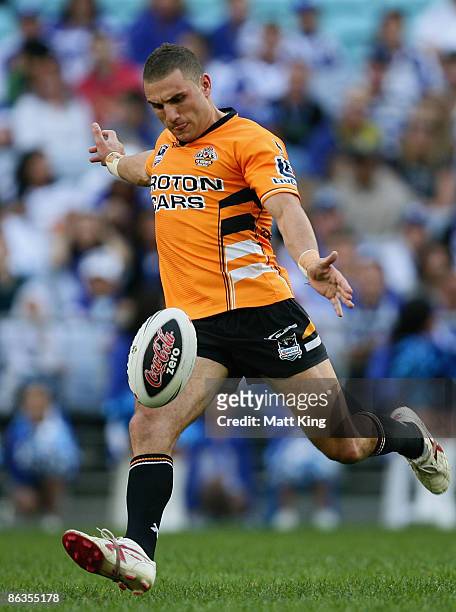 Robbie Farah of the Tigers kicks during the round eight NRL match between the Bulldogs and the Wests Tigers at ANZ Stadium on May 3, 2009 in Sydney,...