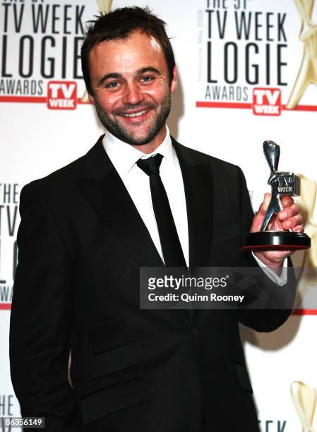 Actor Gyton Grantley poses with the award for Most Outstanding Actor during the 51st TV Week Logie Awards at the Crown Towers Hotel and Casino on May...