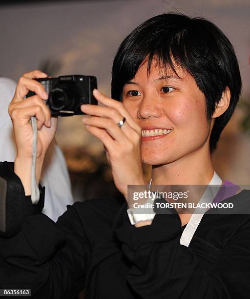 The 'Best Job In The World' finalist Clare Wang of Taiwan takes a photo for her blog site during her first night on Hamilton Island in the Whitsunday...