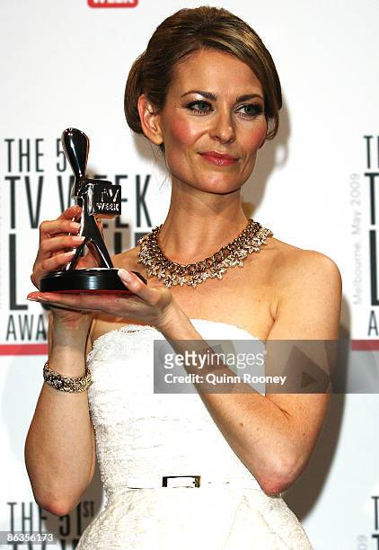Actress Kat Stewart poses with the award for Most Outstanding Actress during the 51st TV Week Logie Awards at the Crown Towers Hotel and Casino on...