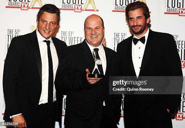 Cast members of The Hollowmen, Merrick Watts, Lachy Hulme and David James pose with the award for Most Outstanding Comedy Program during the 51st TV...