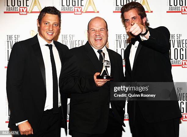 Cast members of The Hollowmen, Merrick Watts, Lachy Hulme and David James pose with the award for Most Outstanding Comedy Program during the 51st TV...