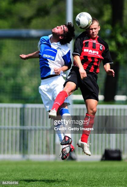 Christopher Griebsch of FC Carl Zeiss Jena and Jonathan Schmid of SC Freiburg battle for the ball during the DFB Juniors Cup match between FC Carl...