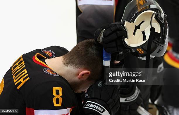 Sebastian Osterloh of Germany looks dejected after the IIHF World Ice Hockey Championship relegation round match between Germany and Austria at the...