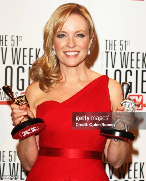 Actress Rebecca Gibney poses with the TV Week Gold Logie and Silver Logie awards uring the 51st TV Week Logie Awards at the Crown Towers Hotel and...