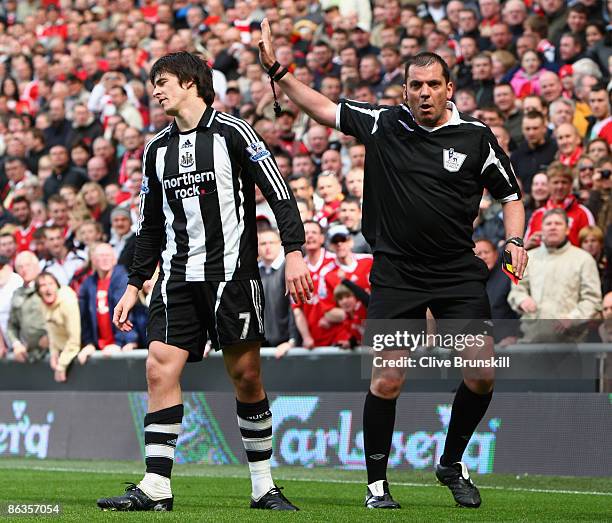 Joey Barton of Newcastle United is sent off by Referee Phil Dowd during the Barclays Premier League match between Liverpool and Newcastle United at...