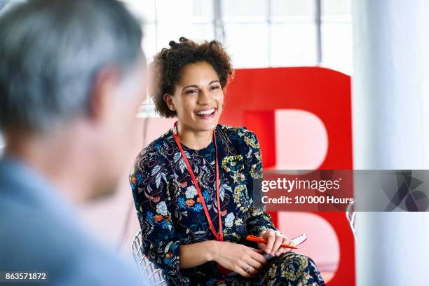 people in modern office - floral pattern dress stock pictures, royalty-free photos & images