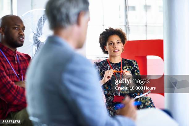 people in modern office - security badge stock pictures, royalty-free photos & images