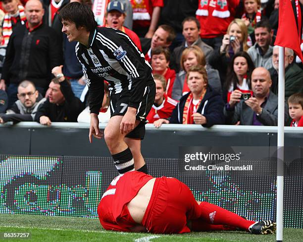 Joey Barton of Newcastle United protests after a challenge on Xabi Alonso of Liverpool and is subsequently sent off by Referee Phil Dowd during the...