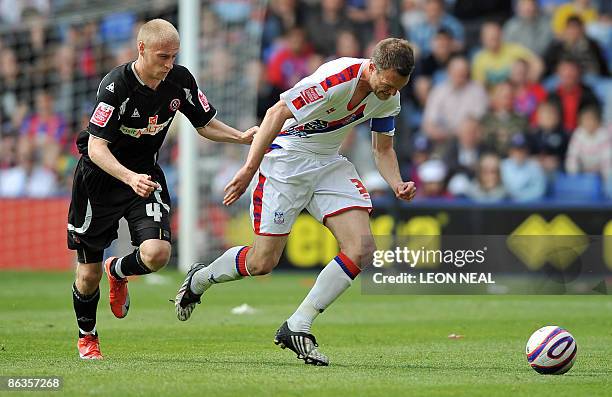 Crystal Palace player Clint Hill avoids a tackle by Sheffield United's David Cotterill during a Championship match at Selhurst Park on May 3, 2009....