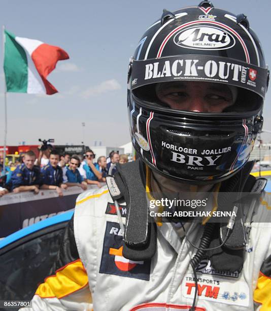 Italy's Nicola Larini celebrates after winning the Marrakech WTCC Fia World Touring Car championship race on May 3, 2009. French Yvan muller placed...