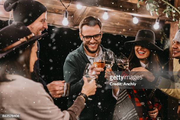 gen z celebrating christmas - friends drinking stock pictures, royalty-free photos & images