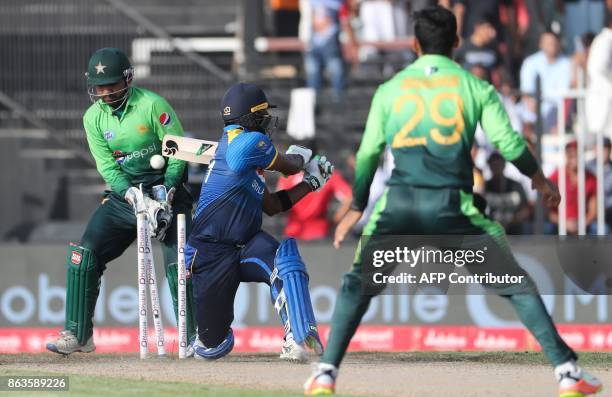 Seekkuge Prasanna of Sri Lanka bats during the third one day international cricket match between Sri Lanka and Pakistan at Sharjah Cricket Stadium in...