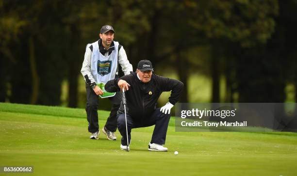 Costantino Rocca of Italy lines up his putt on the 1st green during Day One of the Farmfoods European Senior Masters at Forest Of Arden Marriott...