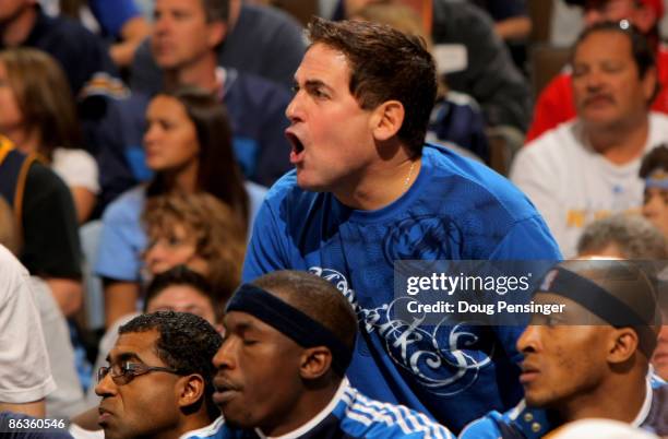 Mark Cuban, owner of the Dallas Mavericks, reacts from behind the team bench as they face the Denver Nuggets in Game One of the Western Conference...