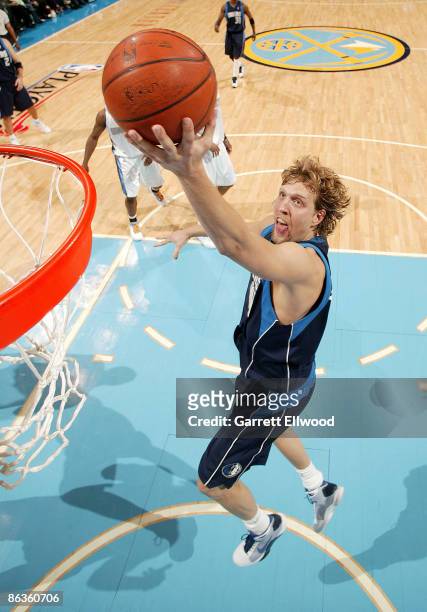 Dirk Nowitzki of the Dallas Mavericks goes to the basket against the Denver Nuggets during Game One of the Western Conference Semifinals during the...