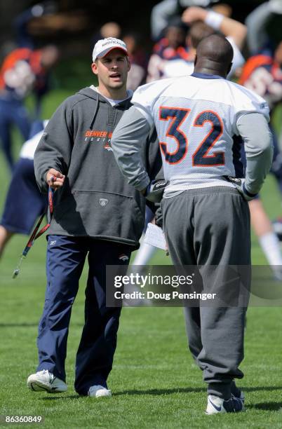 Head coach Josh McDaniels of the Denver Broncos chats with running back LaMont Jordan during minicamp at the Broncos training facility on May 3, 2009...