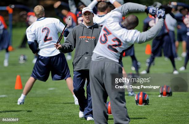 Head coach Josh McDaniels of the Denver Broncos chats with running back LaMont Jordan during minicamp at the Broncos training facility on May 3, 2009...