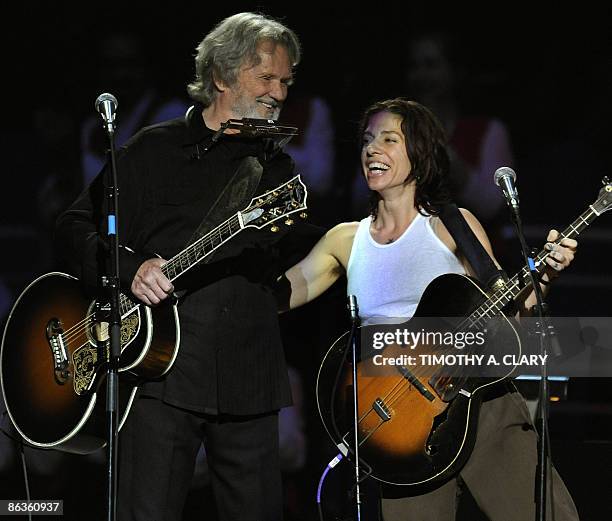 Kris Kristofferson and Ani DiFranco hug during a concert for folk music legend Pete Seeger at Madison Square Garden in New York on May 3, 2009...