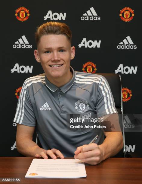 Scott McTominay of Manchester United signs a new contract with the club at Aon Training Complex on October 20, 2017 in Manchester, England.