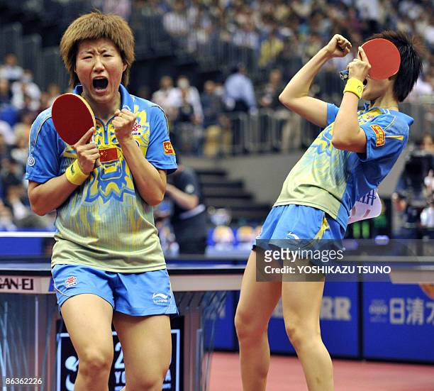 Chinese pair Guo Yan and Ding Ning react as they defeat South Korean pair Park Mi Young and Kim Kyung Ah during the semi-final of the women's doubles...
