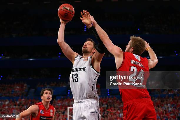 David Anderson of United puts a shot up against Jesse Wagstaff of the Wildcats during the round three NBL match between the Perth Wildcats and...