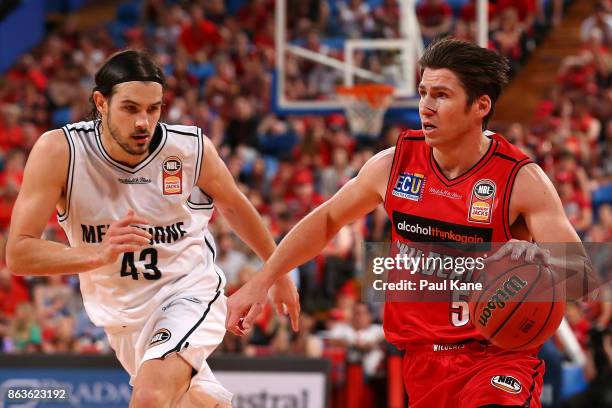 Damian Martin of the Wildcats controls the ball against Chris Goulding of United during the round three NBL match between the Perth Wildcats and...