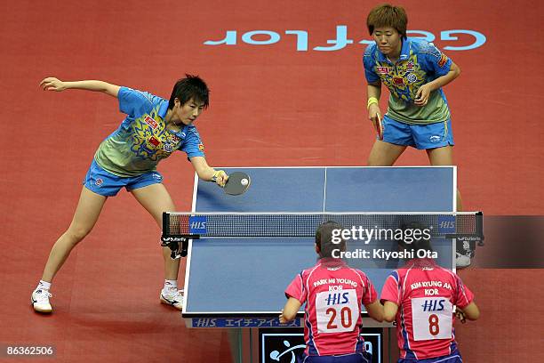 Ding Ning and Guo Yan of China compete in the Women's Doubles semi final match against Kim Kyung-ah and Park Mi-young of South Korea during the World...