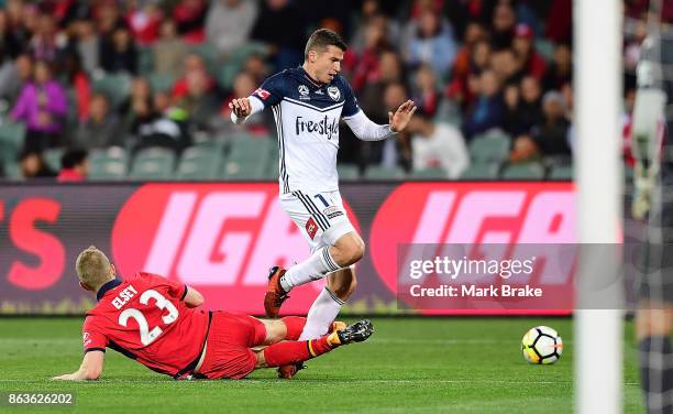 Adelaide's Jordan Elsey tackles Melbourne's MItchell Austin during the round three A-League match between Adelaide United and Melbourne Victory at...