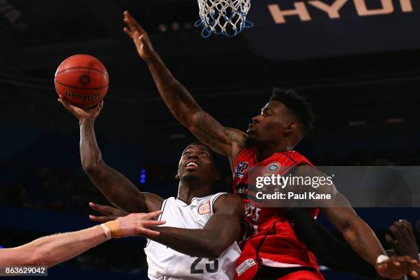 Casey Prather of United lays up against Derek Cooke Jr. Of the Wildcats during the round three NBL match between the Perth Wildcats and Melbourne...