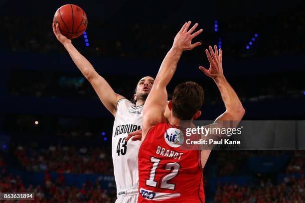 Chris Goulding of United puts a shot up against Angus Brandt of the Wildcats during the round three NBL match between the Perth Wildcats and...