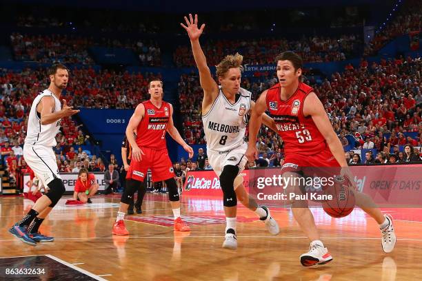 Damian Martin of the Wildcats controls the ball against Kyle Adnam of United during the round three NBL match between the Perth Wildcats and...