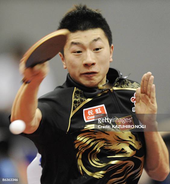 China's Ma Long reaches to return the ball to his compatriot opponent Wang Hao during the semi-final of the men's singles 2009 World Table Tennis...