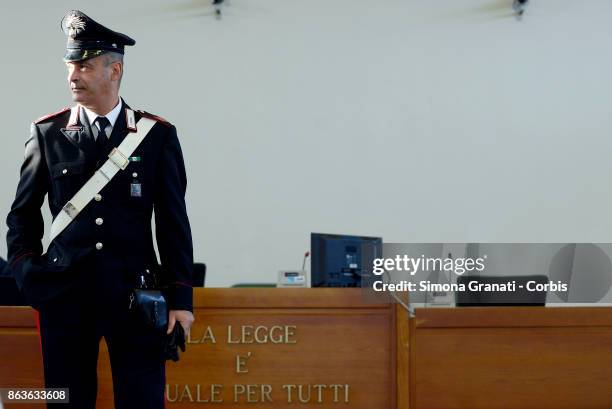 Carabiniere stands near the sign 'La legge Ã¨ uguale per tutti' during the New trial against five military police officers for the death Stefano...