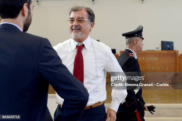 The lawer Fabio Anselmo stands near the sign 'La legge Ã¨ uguale per tutti' during the New trial against five military police officers for the death...