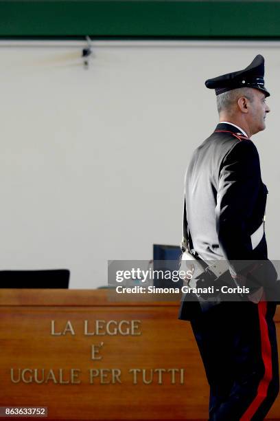 Carabiniere stands near the sign 'La legge Ã¨ uguale per tutti' during the New trial against five military police officers for the death Stefano...