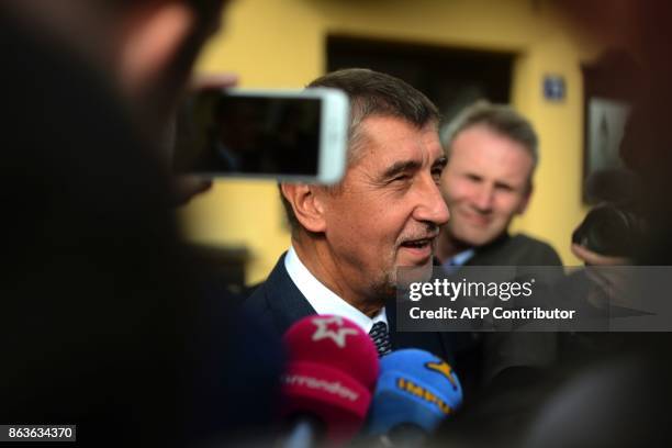 Czech billionaire Andrej Babis, chairman of the ANO movement , talks to the media after voting at a polling station during the first day of the Czech...