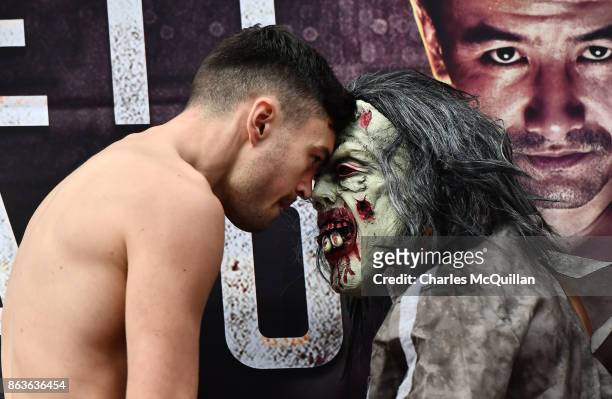 Renald Garrido of France wearing a halloween costume goes head to head with Tyrone McKenna of Northern Ireland at the weigh in for the Ryan Burnett v...