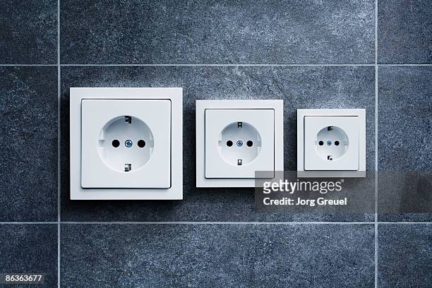 electric outlets (german) in different sizes - presa di corrente foto e immagini stock
