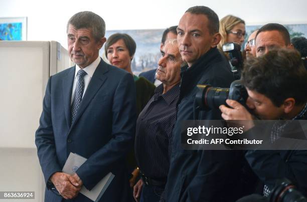 Czech billionaire Andrej Babis , chairman of the ANO movement , waits to cast his ballot at a polling station during the first day of the Czech...