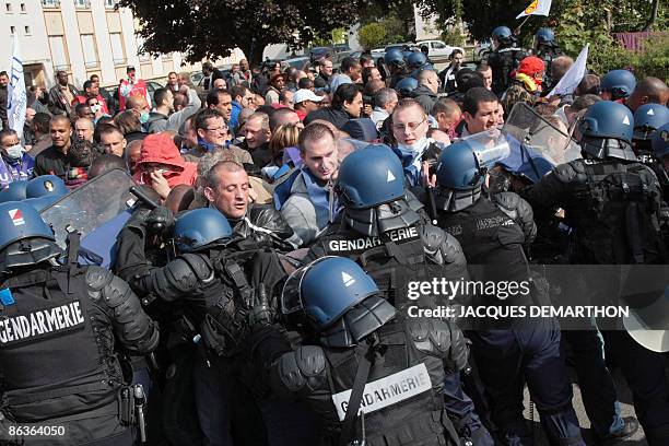 Prison guards blocking access to the prison in Fleury-Merogis, outside of Paris, clash with French police on May 4, 2009 during a national...