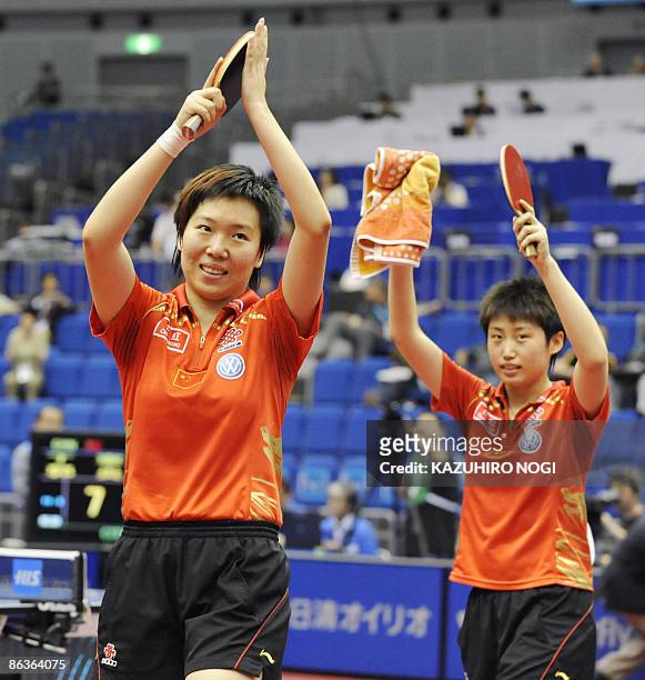 Chinese pair Guo Yue and Li Xiaoxia celebrate their win over compatriot Ding Ning and Guo Yan in the women's final match at the World Table Tennis...
