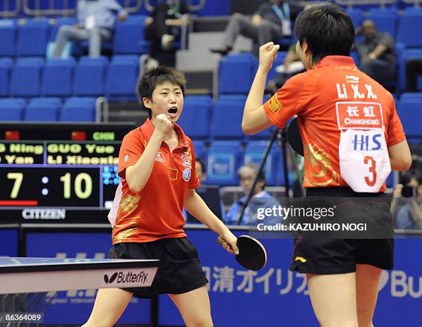 Chinese pair Guo Yue and Li Xiaoxia celebrate their win over compatriot Ding Ning and Guo Yan in the women's final match at the World Table Tennis...