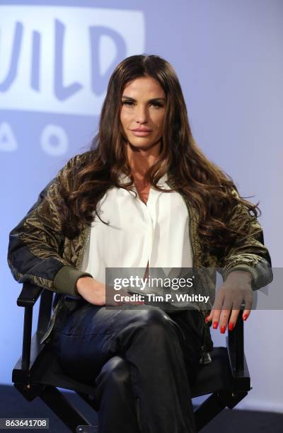 Katie Price poses for a photo after a discussion about her new book 'Playing with Fire' and her career at BUILD London on October 20, 2017 in London,...